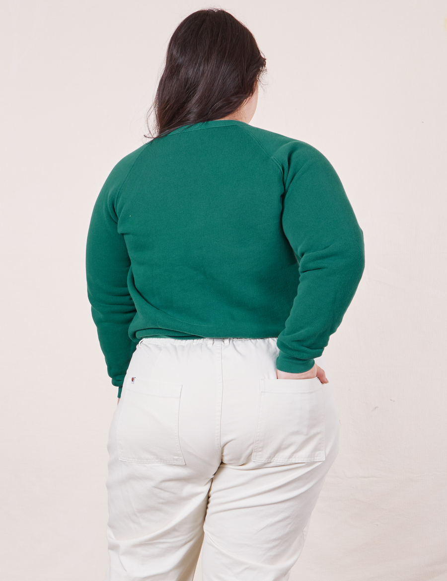 Back view of Heavyweight Crew in Hunter Green and vintage off-white Western Pants worn by Ashley