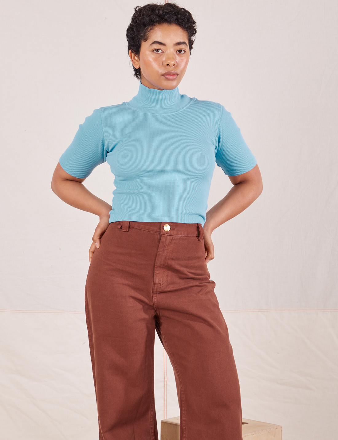 1/2 Sleeve Essential Turtleneck in Baby Blue on Mika wearing fudgesicle brown Bell Bottoms