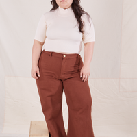 Ashley is wearing size M 1/2 Sleeve Essential Turtleneck in Vintage Off White paired with fudgesicle brown Bell Bottoms