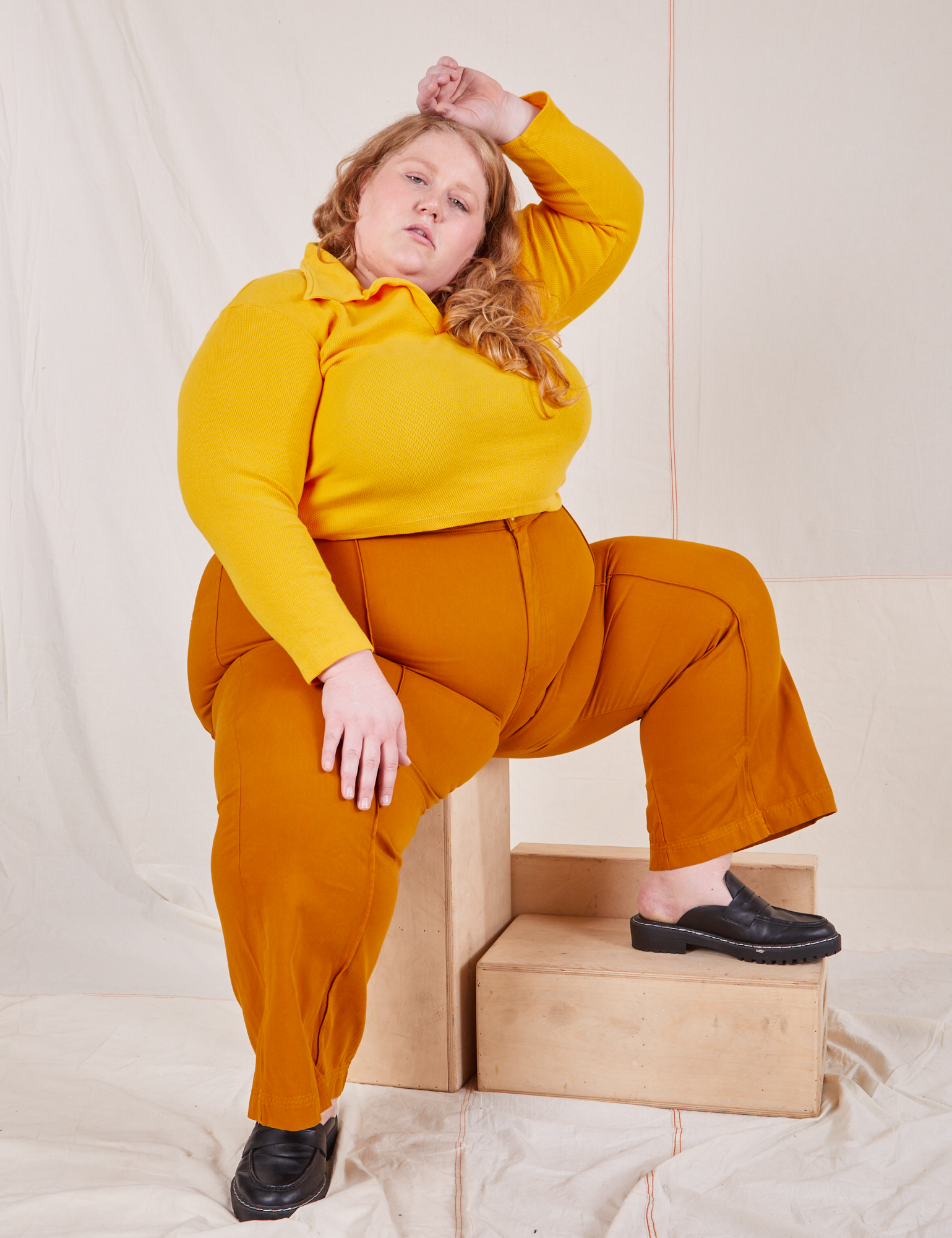 Catie is wearing Long Sleeve Fisherman Polo in Sunshine Yellow and spicy mustard Western Pants
