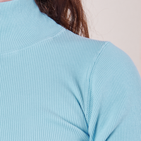 1/2 Sleeve Essential Turtleneck in Baby Blue front close up on Alex