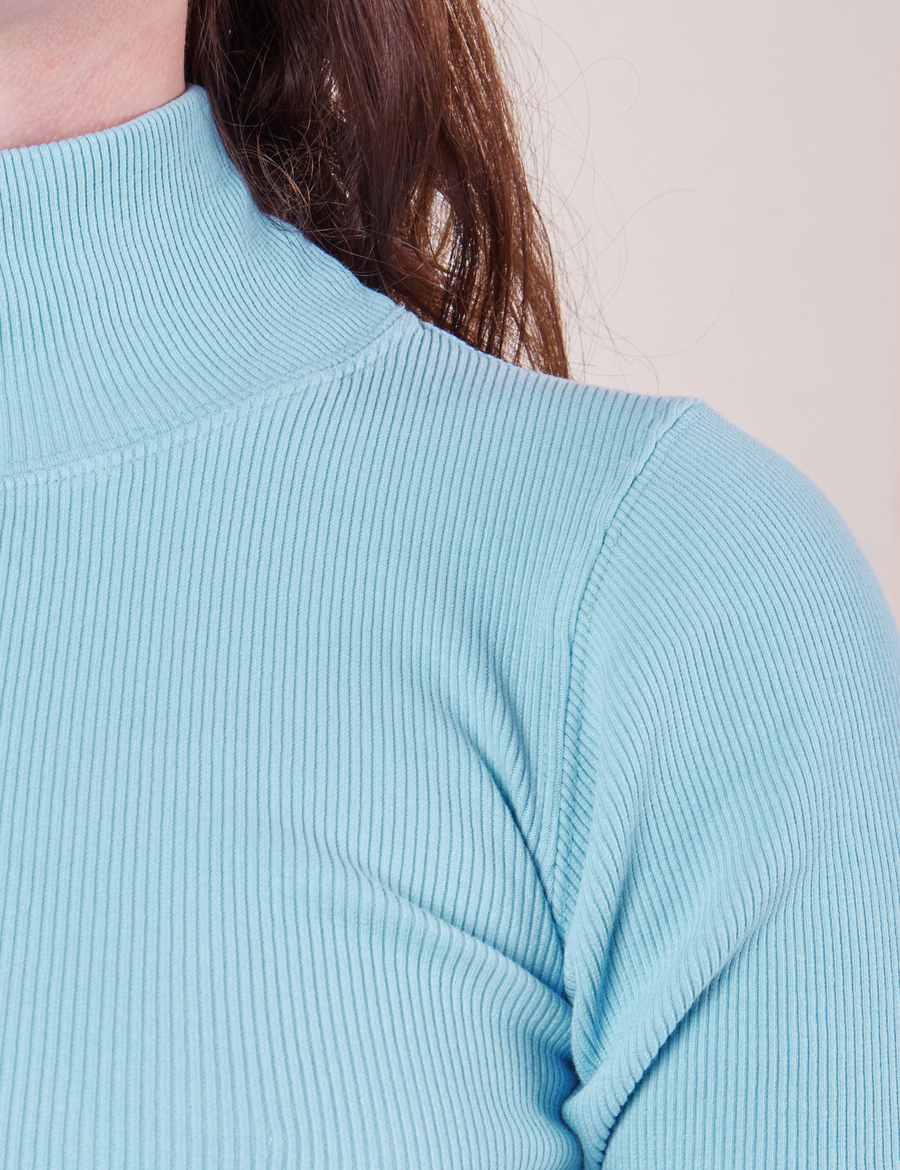 1/2 Sleeve Essential Turtleneck in Baby Blue front close up on Alex