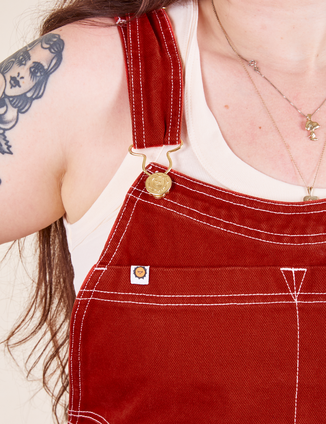 Original Overalls in Paprika front close up white stitching and gold hardware on Sydney