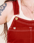 Original Overalls in Paprika front close up white stitching and gold hardware on Sydney