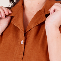 Pantry Button-Up in Burnt Terracotta Faye holding collar front close up