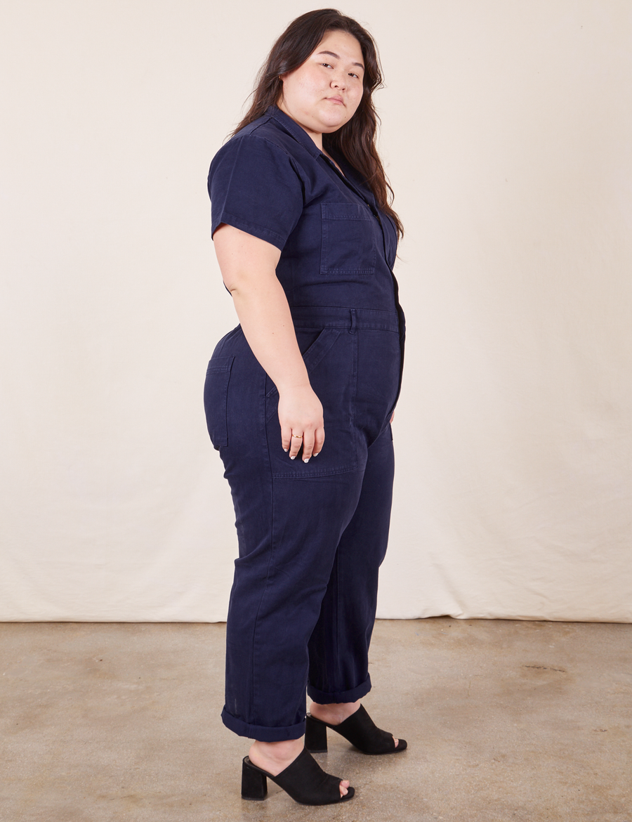 Side view of Short Sleeve Jumpsuit in Navy Blue worn by Ashley