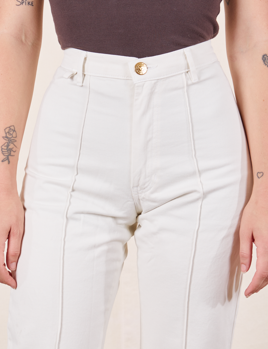 Western Pants in Vintage Tee Off-White front close up on Alex