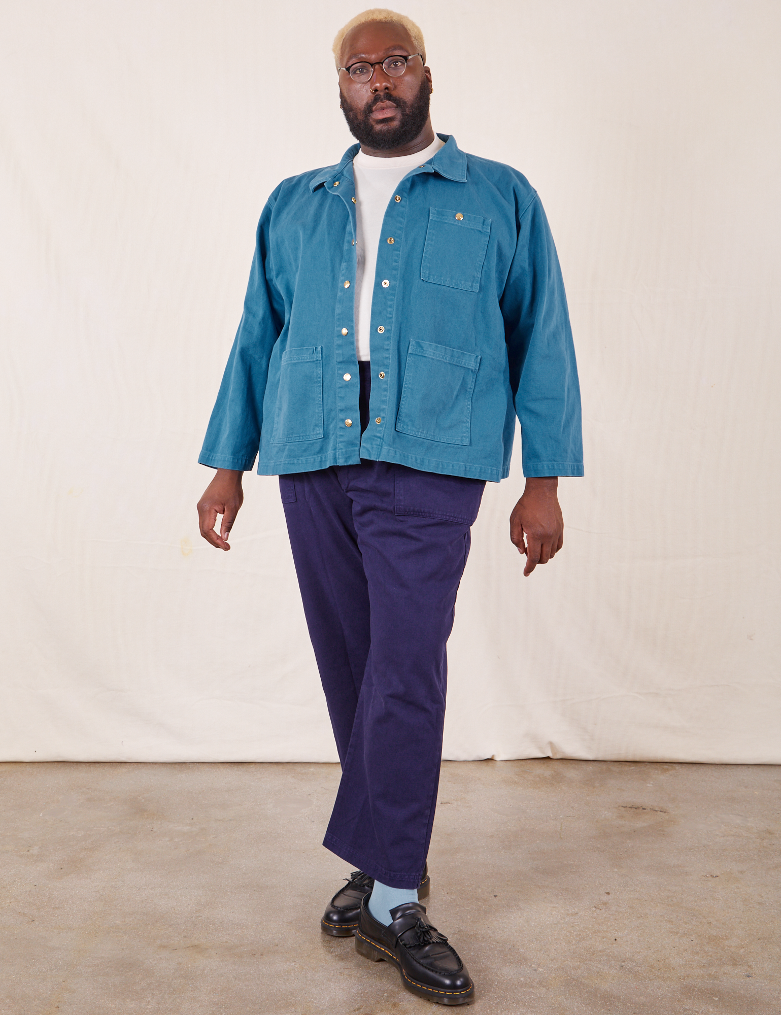 Elijah is 6&#39;4&quot; and wearing 3XL Denim Work Jacket in Marine Blue paired with navy Work Pants