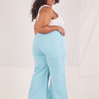 Angled back view of Bell Bottoms in Baby Blue worn by Morgan