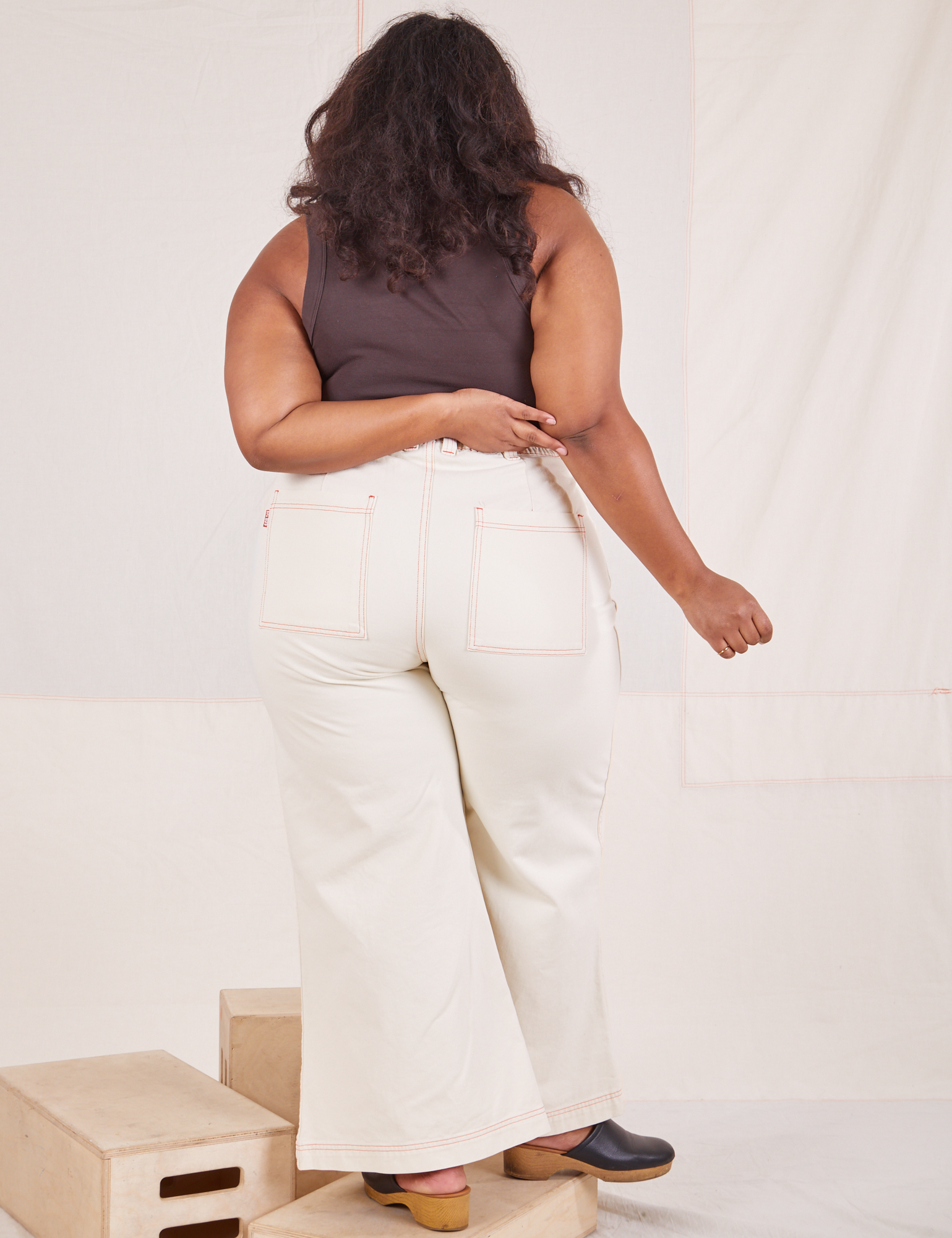 Back view of Bell Bottoms in Vintage Off-White and espresso brown Tank Top worn by Morgan