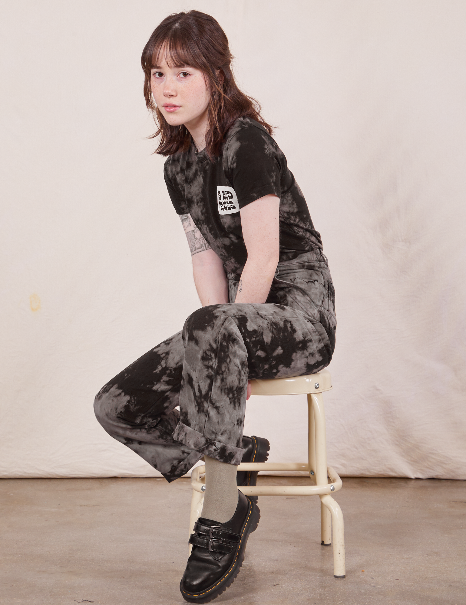 Hana is wearing Black Magic Waters Tee paired with matching Work Pants