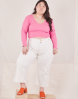 Ashley is wearing Long Sleeve V-Neck Tee in Bubblegum Pink and vintage off-white Western Pants