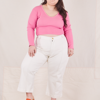 Ashley is wearing Long Sleeve V-Neck Tee in Bubblegum Pink and vintage off-white Western Pants