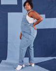 Side view of Indigo Denim Original Overalls in Light Wash worn by Morgan