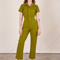 Alex is 5'8" and wearing XS Short Sleeve Jumpsuit in Olive Green