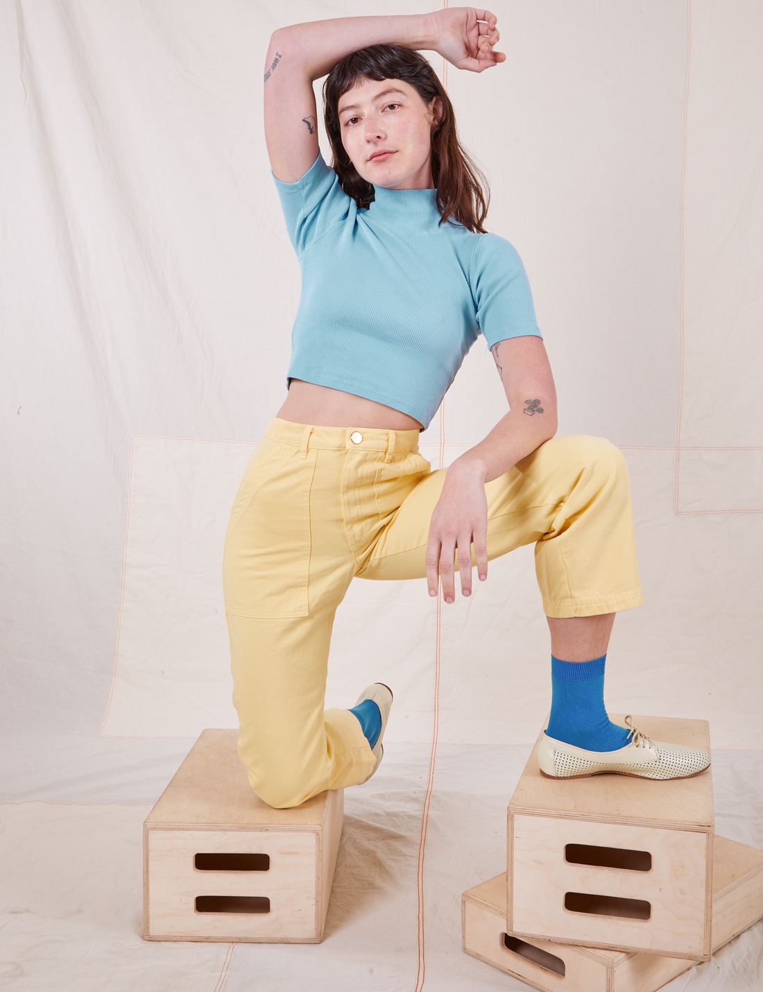 1/2 Sleeve Essential Turtleneck in Baby Blue on Alex in Butter Yellow Work Pants.