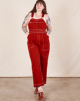 Sydney is wearing Original Overalls in Paprika and vintage off-white Tank Top