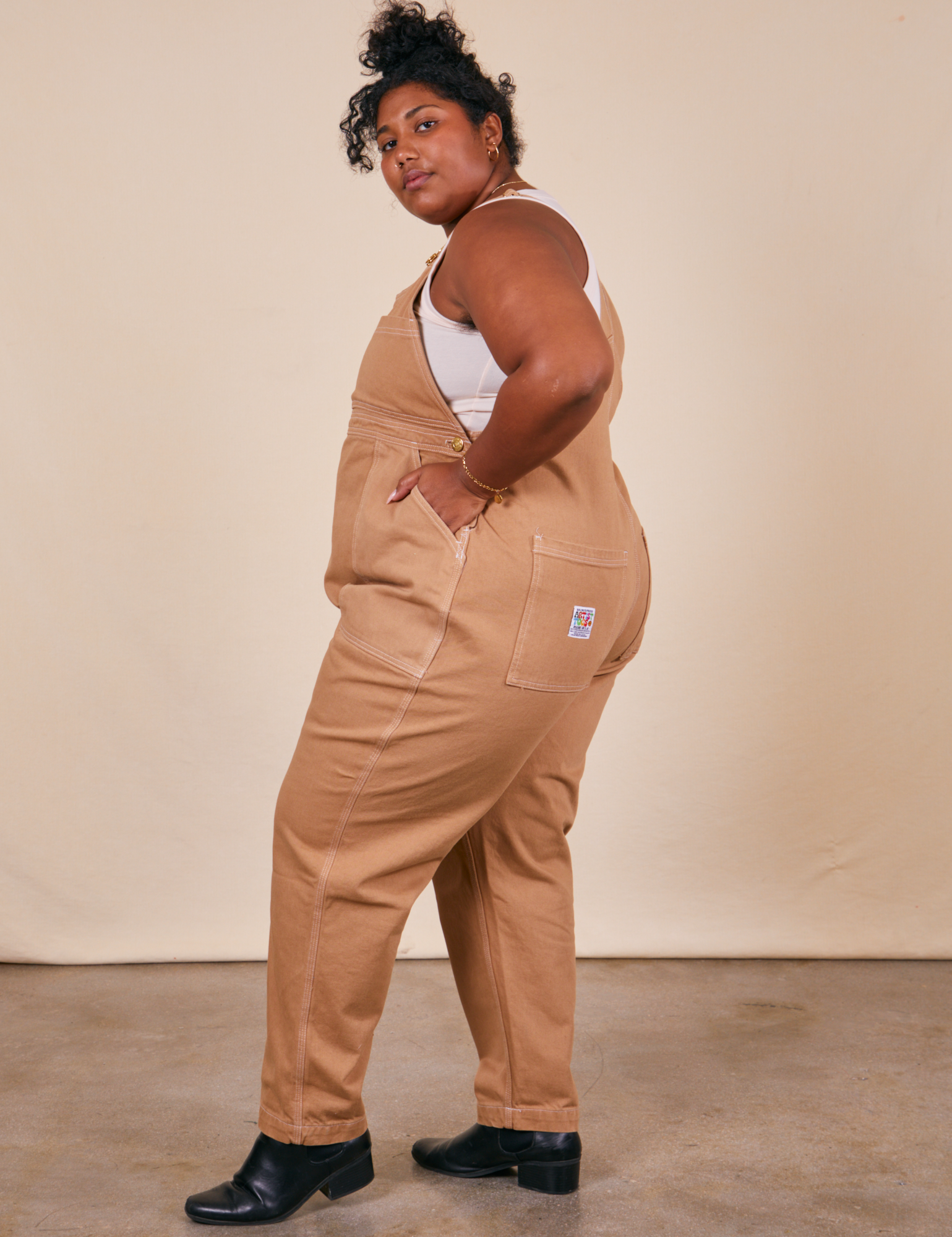 Side view of Original Overalls in Tan worn by Morgan