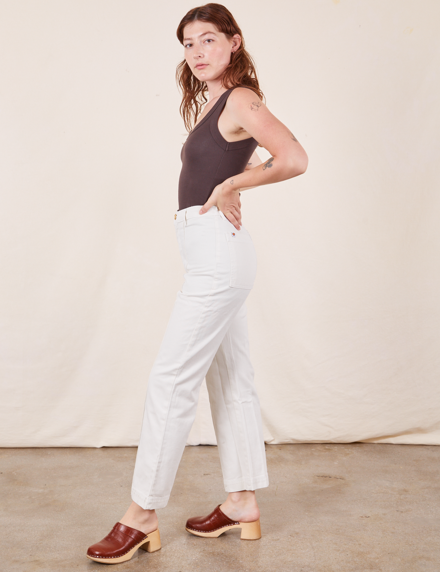 Side view of Western Pants in Vintage Tee Off-White and espresso brown Tank Top on Alex