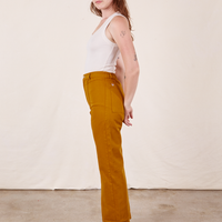 Western Pants in Spicy Mustard side view on Alex wearing vintage off-white Tank Top