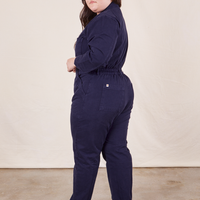 Side view of Everyday Jumpsuit in Navy Blue worn by Ashley