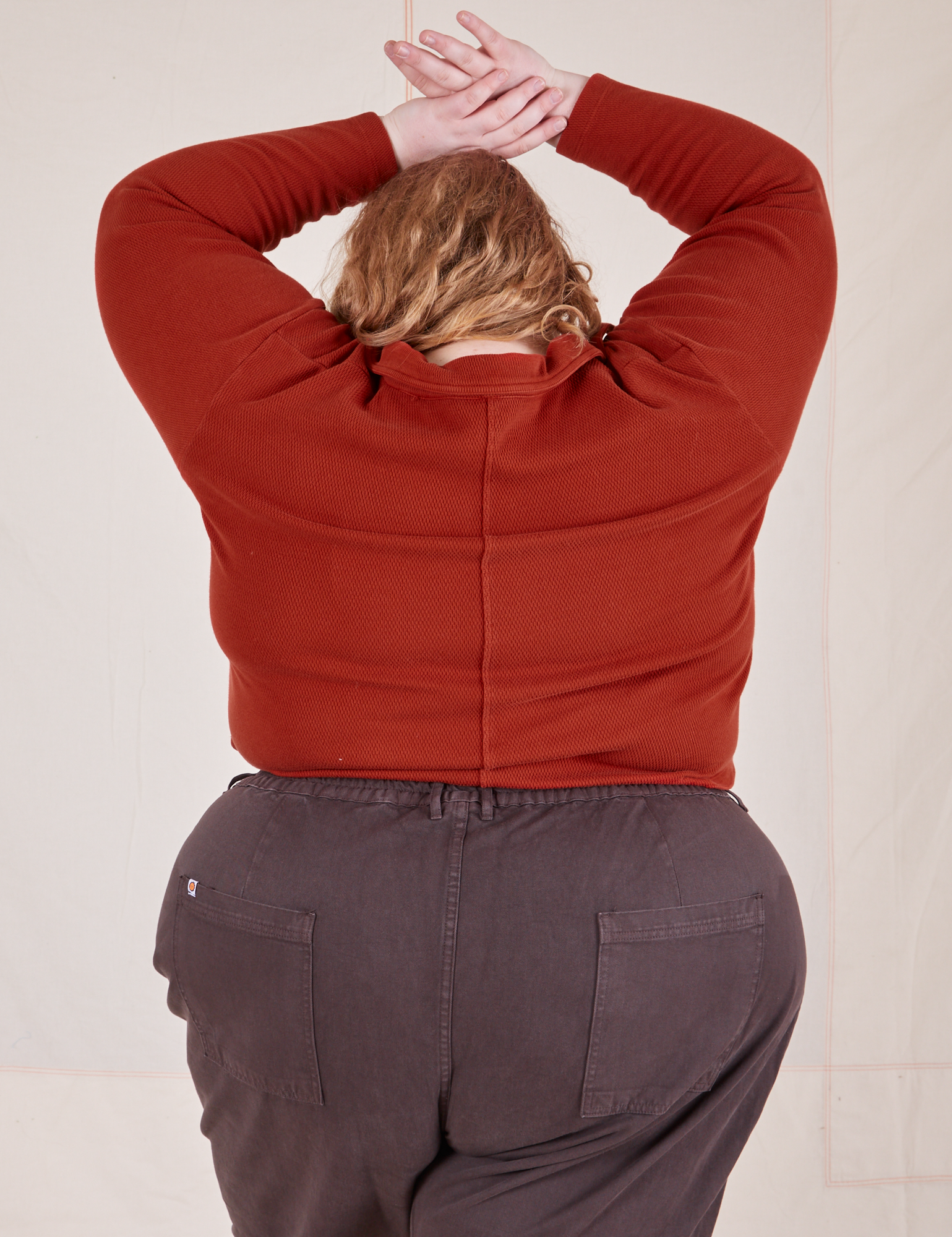 Back view of Long Sleeve Fisherman Polo in Paprika worn by Catie