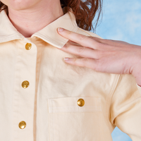 David Neoclassical Work Jacket front close up on Alex touching jacket collar