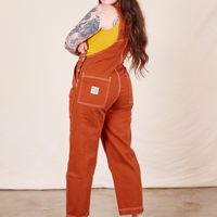 Back view of Original Overalls in Burnt Terracotta worn by Sydney