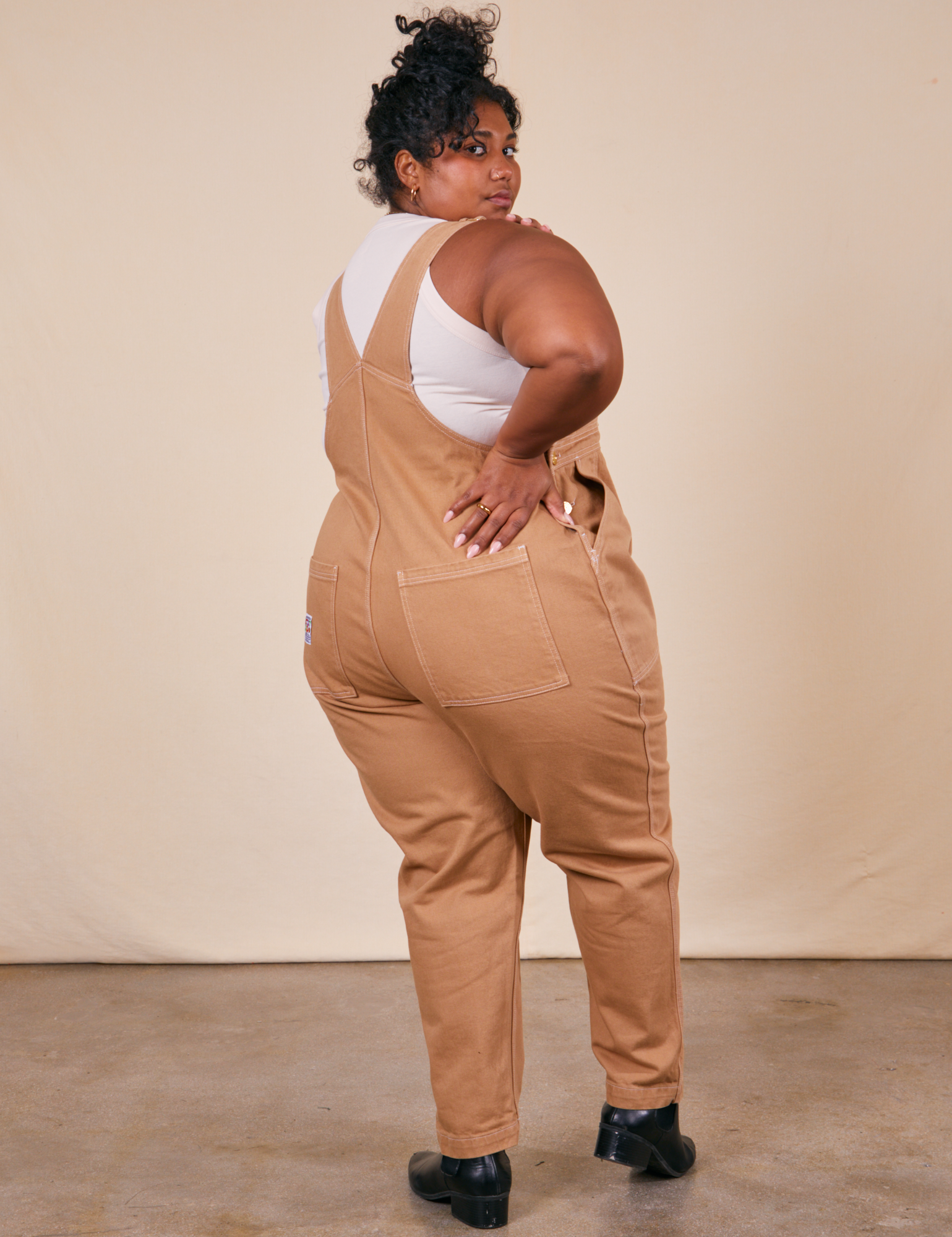 Back view of Original Overalls in Tan worn by Morgan