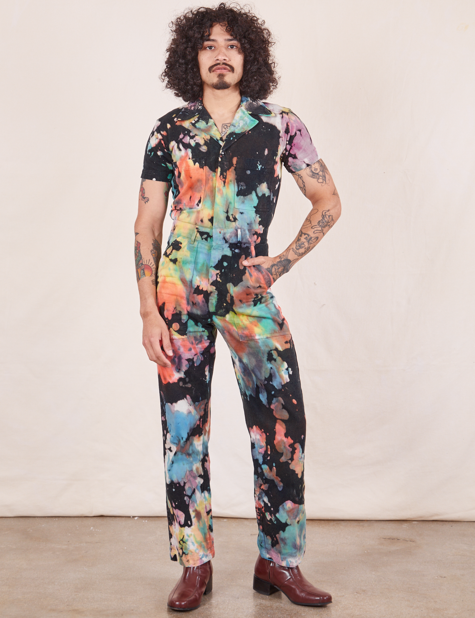 Jesse is 5&#39;8&quot; and wearing size S Short Sleeve Jumpsuit in Rainbow Magic Waters