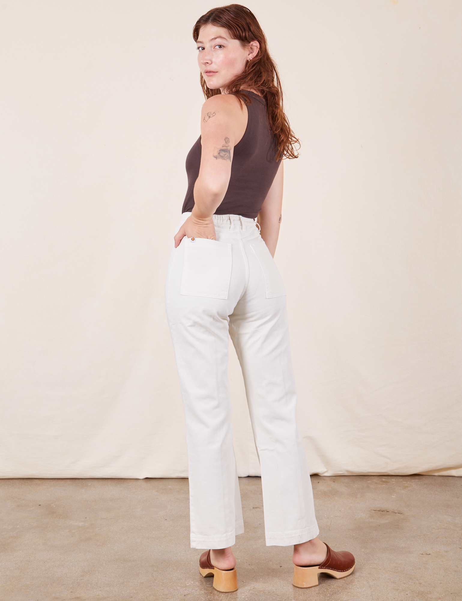 Back view of Western Pants in Vintage Tee Off-White and espresso brown Tank Top on Alex