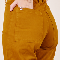 Western Pants in Spicy Mustard hand in back pocket on Alex