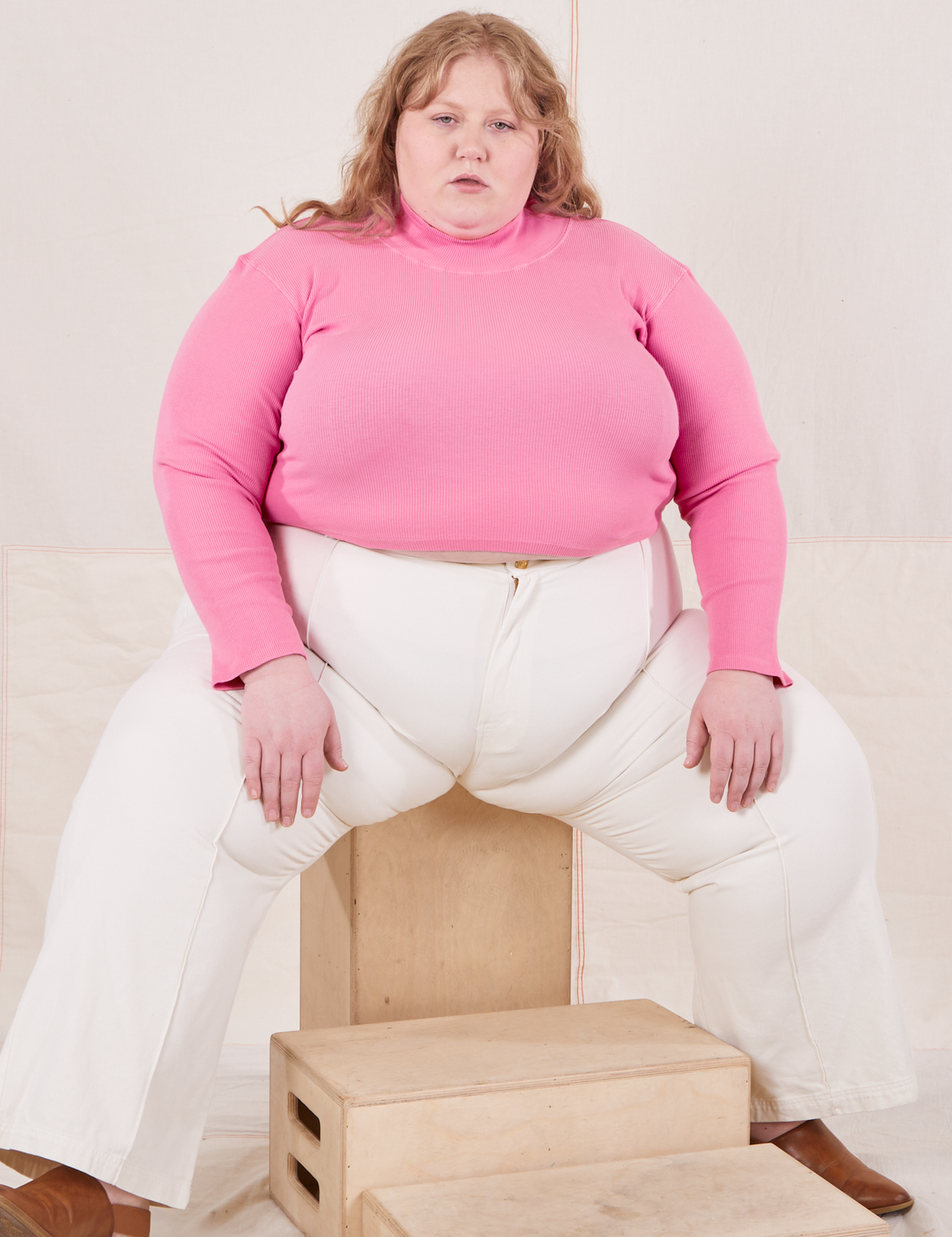 Catie is wearing Essential Turtleneck in Bubblegum Pink and vintage off-white Western Pants