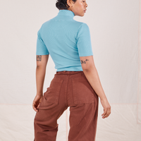1/2 Sleeve Essential Turtleneck in Baby Blue back view on Mika paired with fudgesicle brown Bell Bottoms