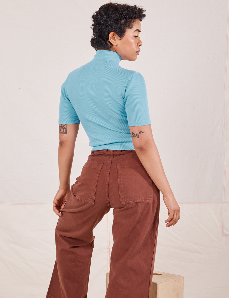 1/2 Sleeve Essential Turtleneck in Baby Blue back view on Mika paired with fudgesicle brown Bell Bottoms
