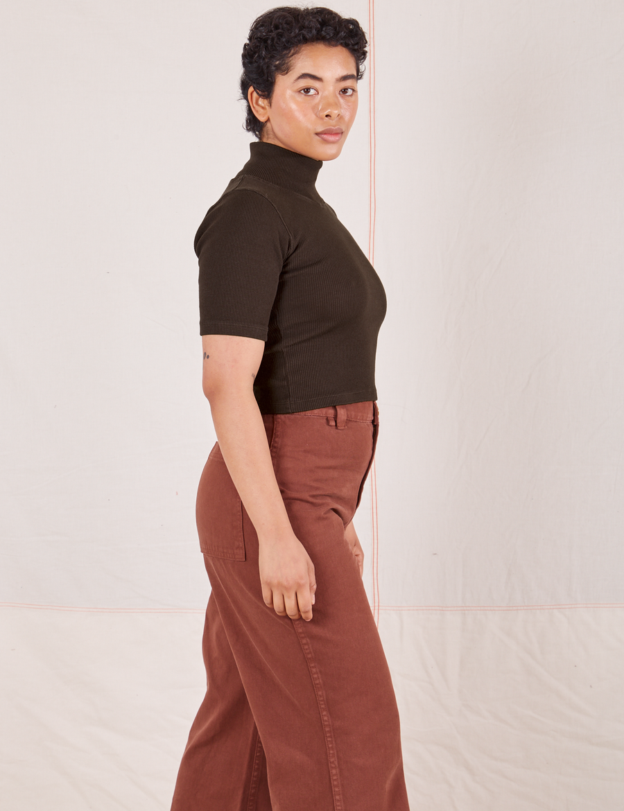 Side view of Mika wearing 1/2 Sleeve Essential Turtleneck in Espresso Brown and fudgesicle brown Bell Bottoms