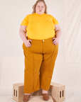 Catie is wearing 3XL Organic Vintage Tee in Sunshine Yellow paired with spicy mustard Western Pants