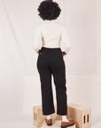 Back view of Organic Work Pants in Basic Black worn by Reece