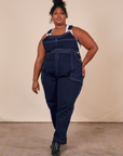 Morgan is 5'5" and wearing 1XL Original Overalls in Navy Blue