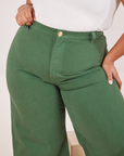 Front close up of Bell Bottoms in Dark Emerald Green worn by Morgan