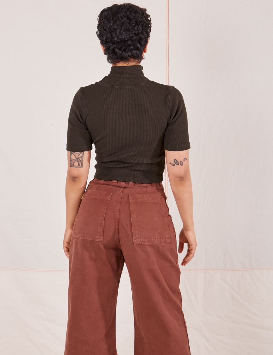 Back view of Mika wearing 1/2 Sleeve Essential Turtleneck in Espresso Brown and fudgesicle brown Bell Bottoms