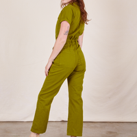 Back view of Short Sleeve Jumpsuit in Olive Green worn by Alex