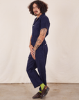 Side view of Short Sleeve Jumpsuit in Navy Blue worn by Jesse