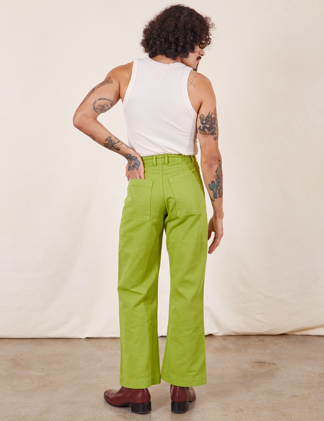 Western Pants in Gross Green back view on Jesse wearing vintage off-white Tank Top