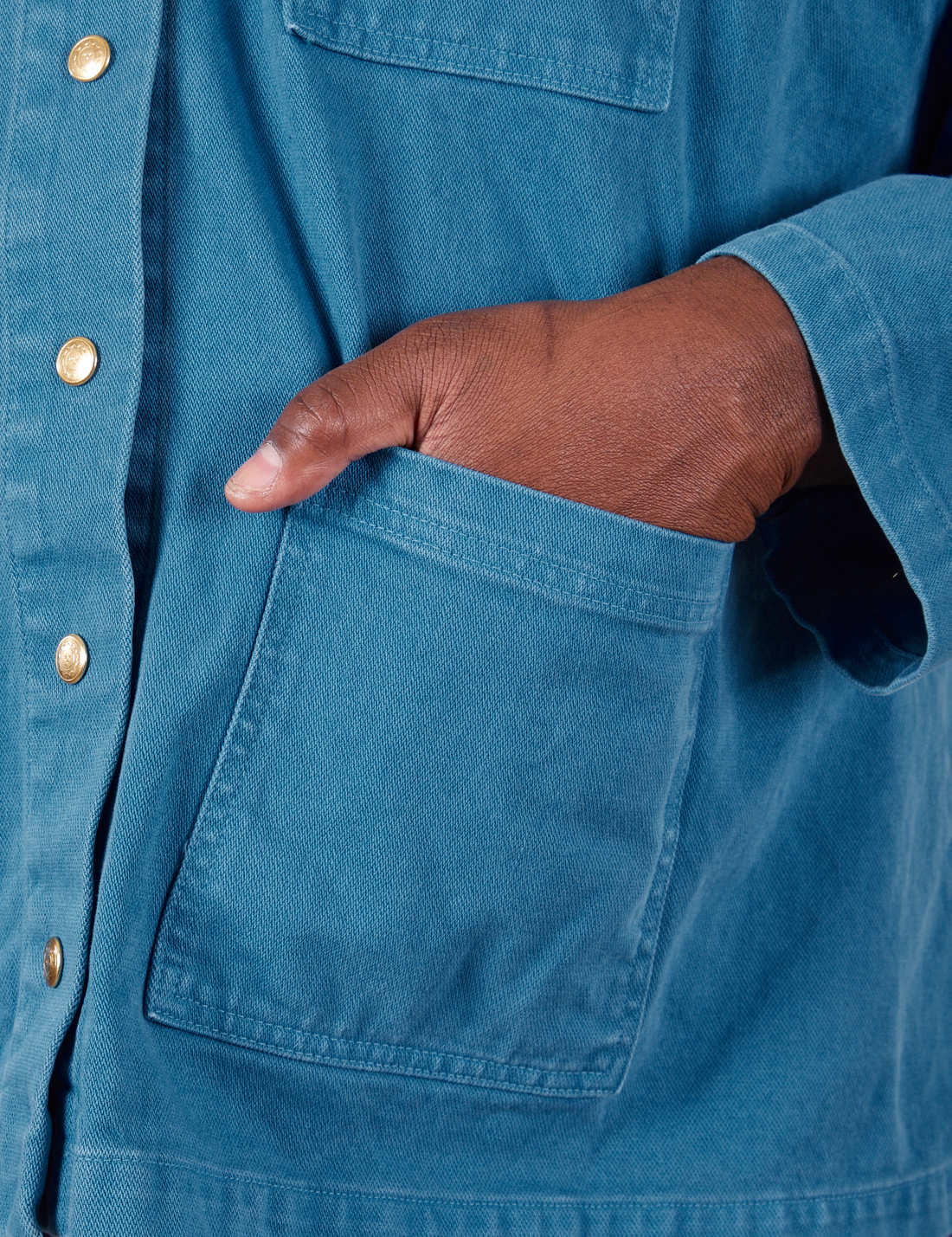 Denim Work Jacket in Marine Blue hand in bottom front pocket close up on Elijah