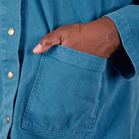 Denim Work Jacket in Marine Blue hand in bottom front pocket close up on Elijah