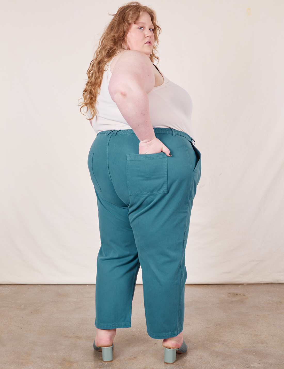 Work Pants in Marine Blue back view on Catie wearing vintage off-white Tank Top