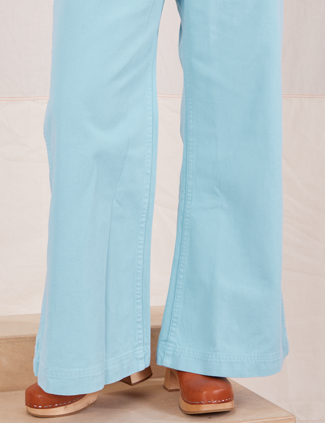 Pant leg close up of Bell Bottoms in Baby Blue worn by Hana