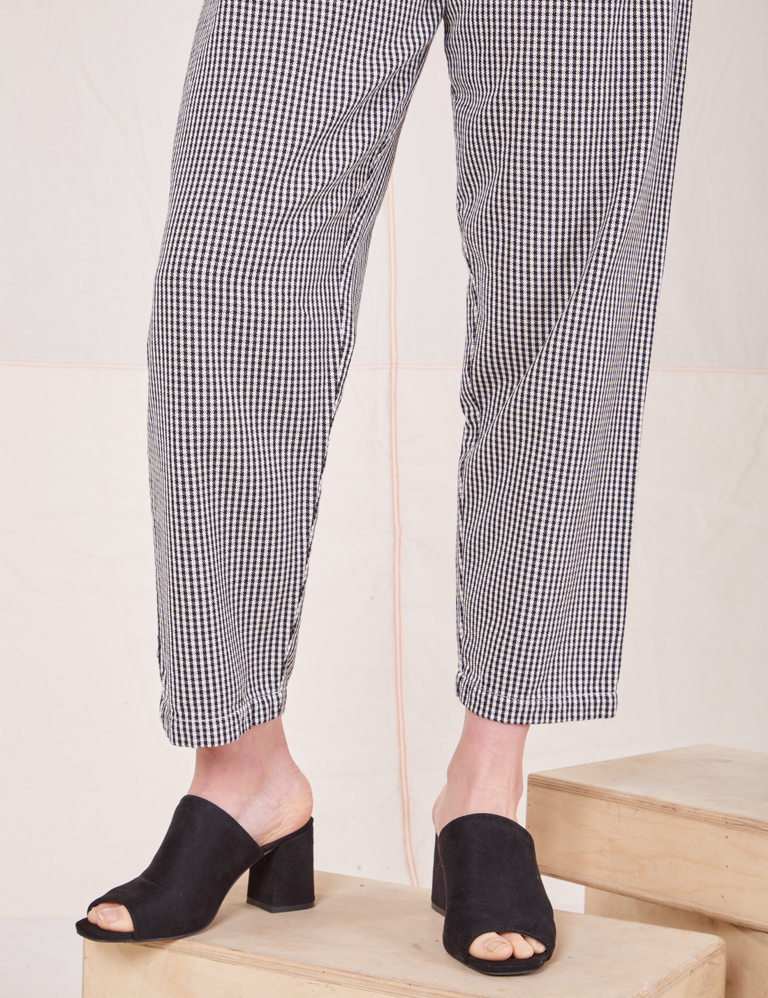 Pant leg close up of Checker Trousers in Black & White worn by Allison