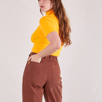 1/2 Sleeve Essential Turtleneck in Sunshine Yellow back view on Allison wearing fudgesicle brown Bell Bottoms